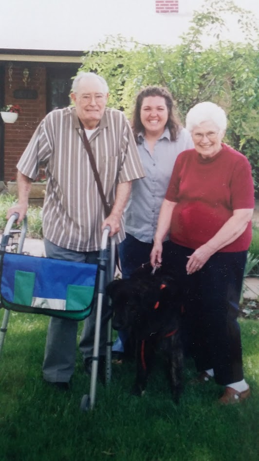 Susie with family members and a dog